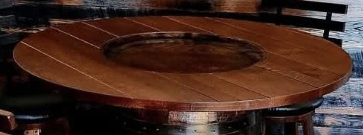 Whiskey Barrel Table Bourbon Barrel Table Top Pub Height Elevated Metal Footrest 4 - 6 Cushioned Stave Stools